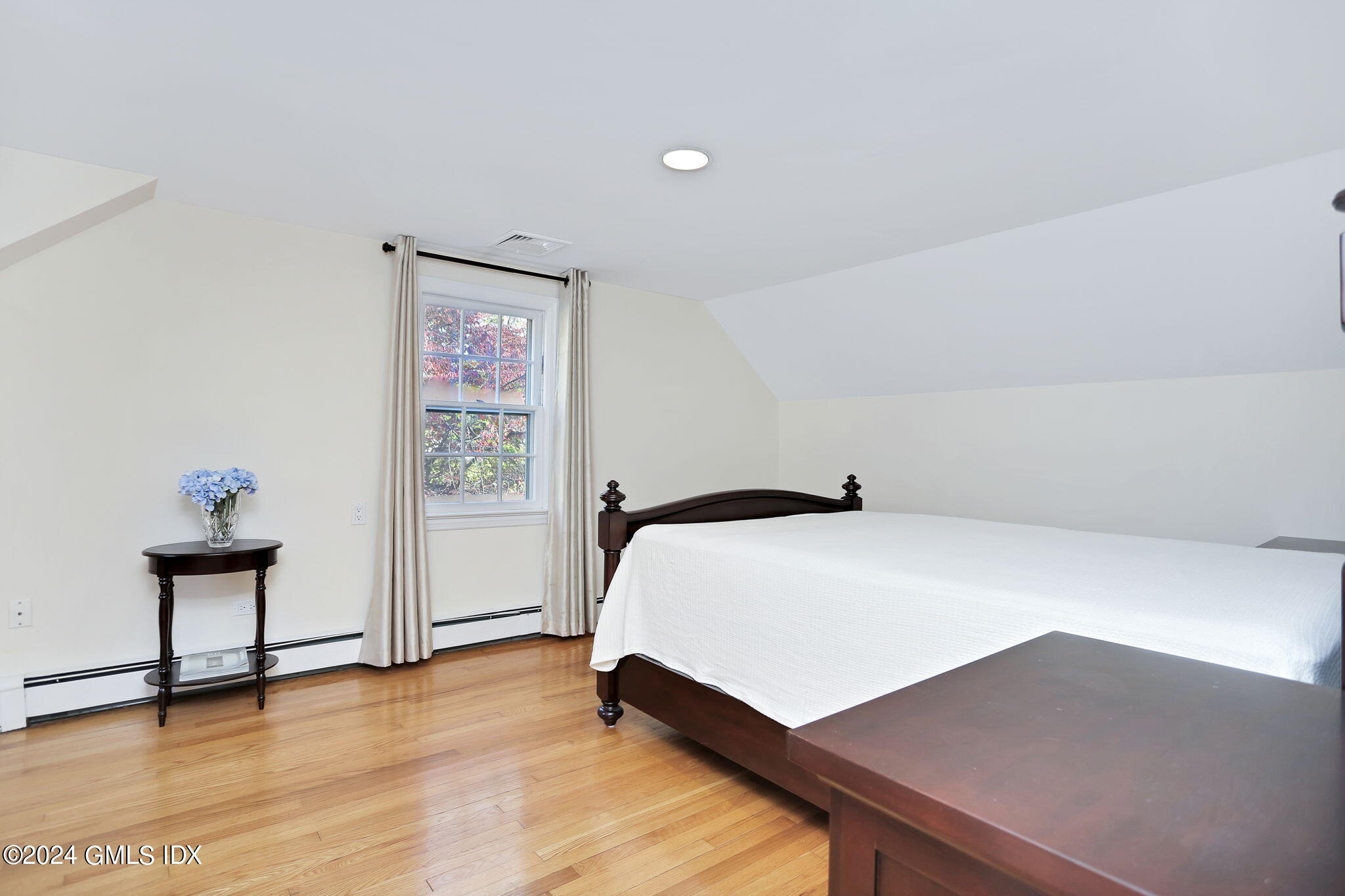 44 Hendrie Avenue Riverside, CT 06878 - Photo 18 of 40 a bedroom with a bed and a desk