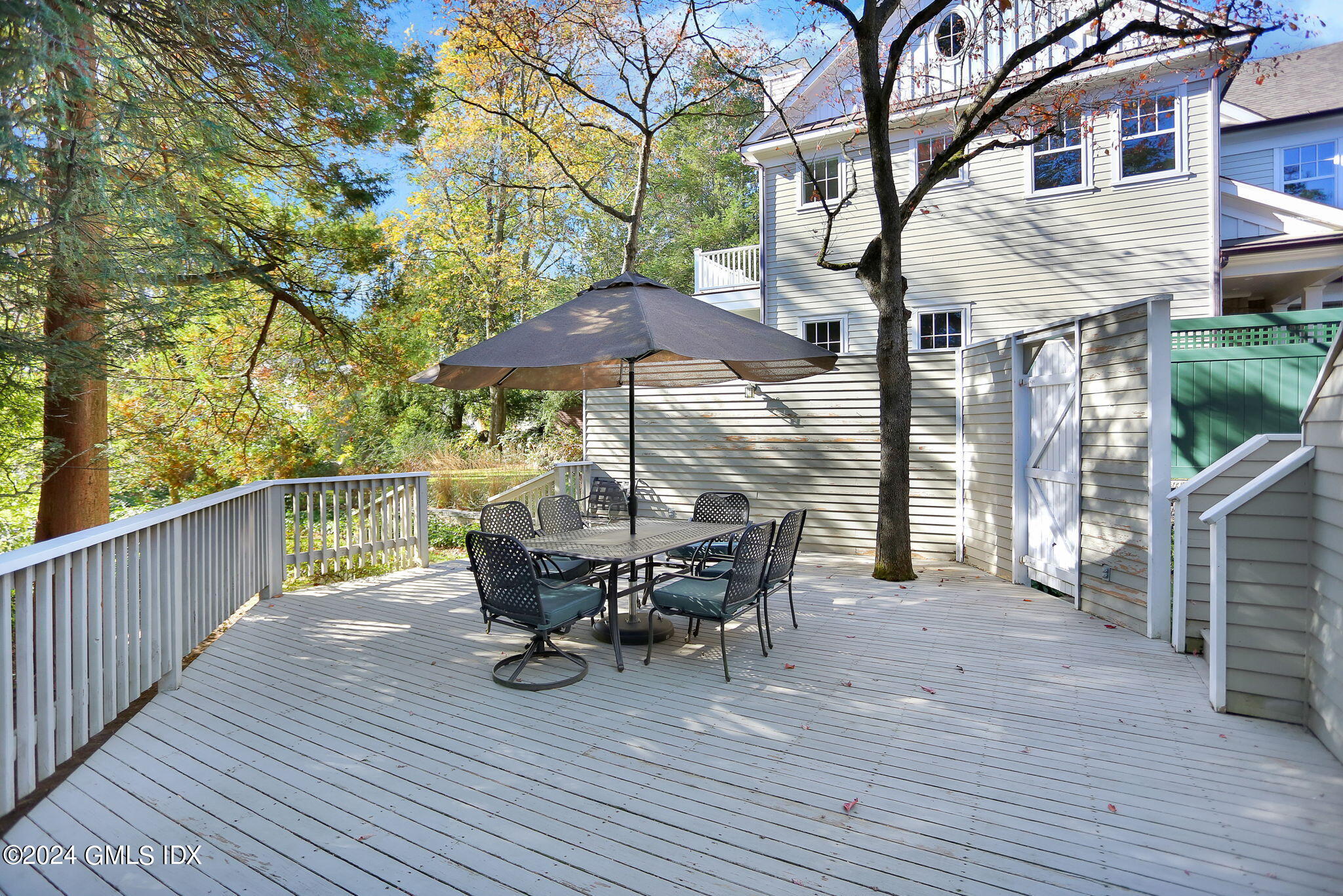44 Hendrie Avenue Riverside, CT 06878 - Photo 28 of 40 a view of a deck with furniture and trees