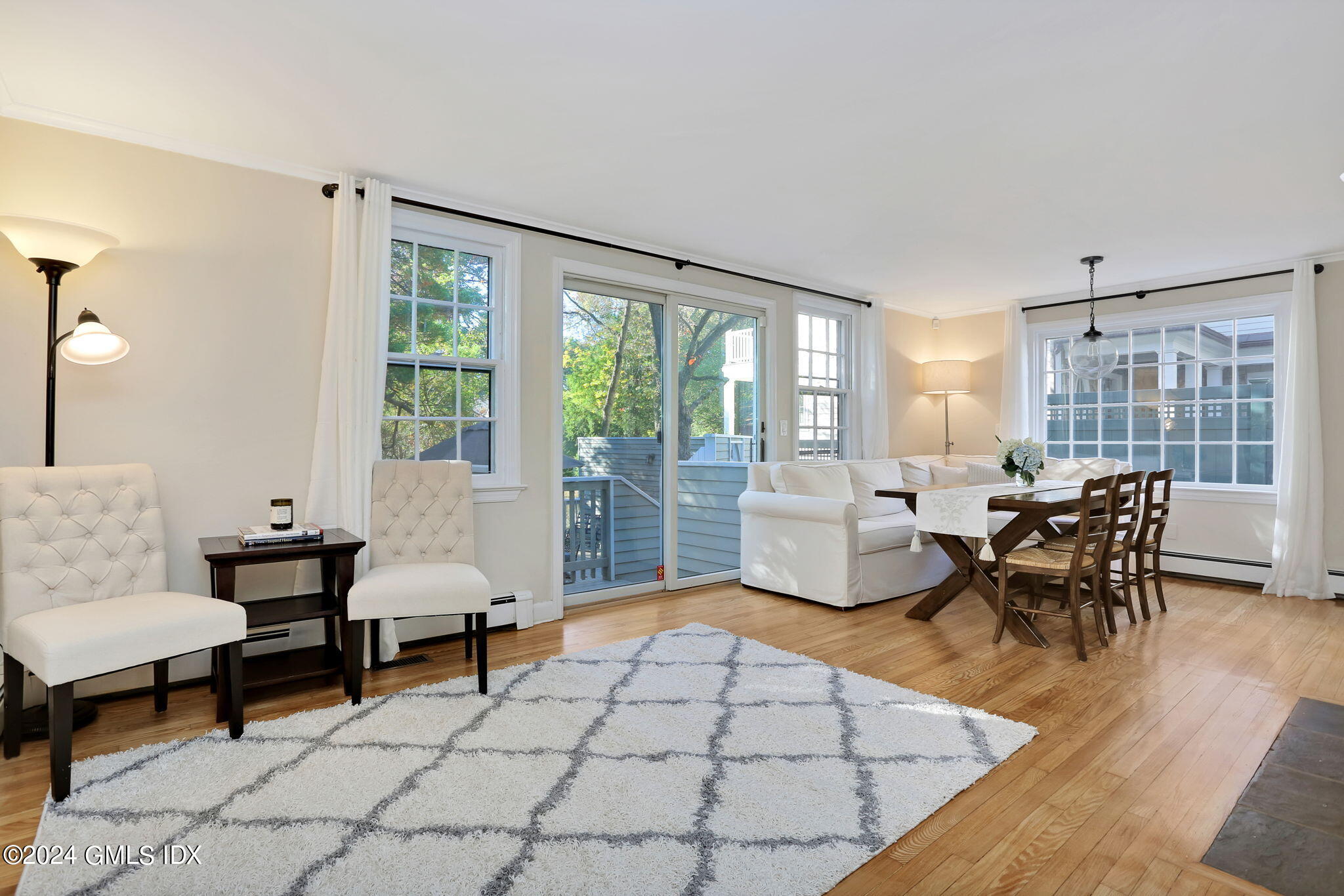 44 Hendrie Avenue Riverside, CT 06878 - Photo 9 of 40 a living room with furniture and a large window
