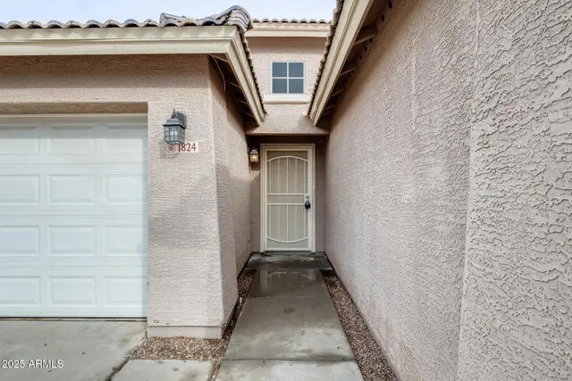 a front view of a house with a garage