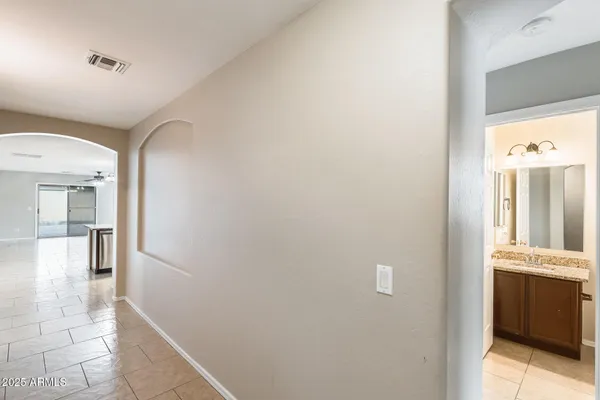 a view of a hallway with a white walls