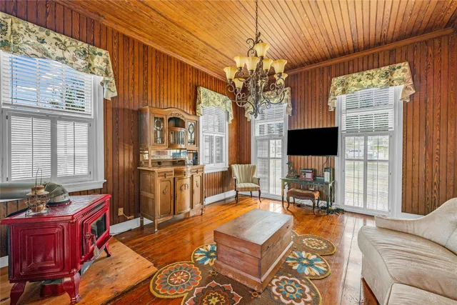 a living room with fireplace furniture and a flat screen tv