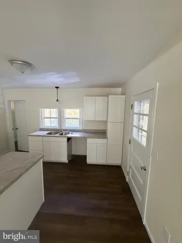 a kitchen with a stove and a sink
