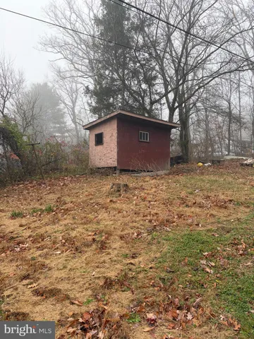 a view of a living room and chandelier