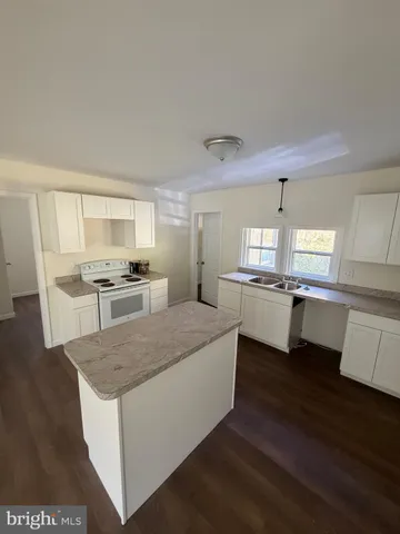 a kitchen with counter top space and appliances