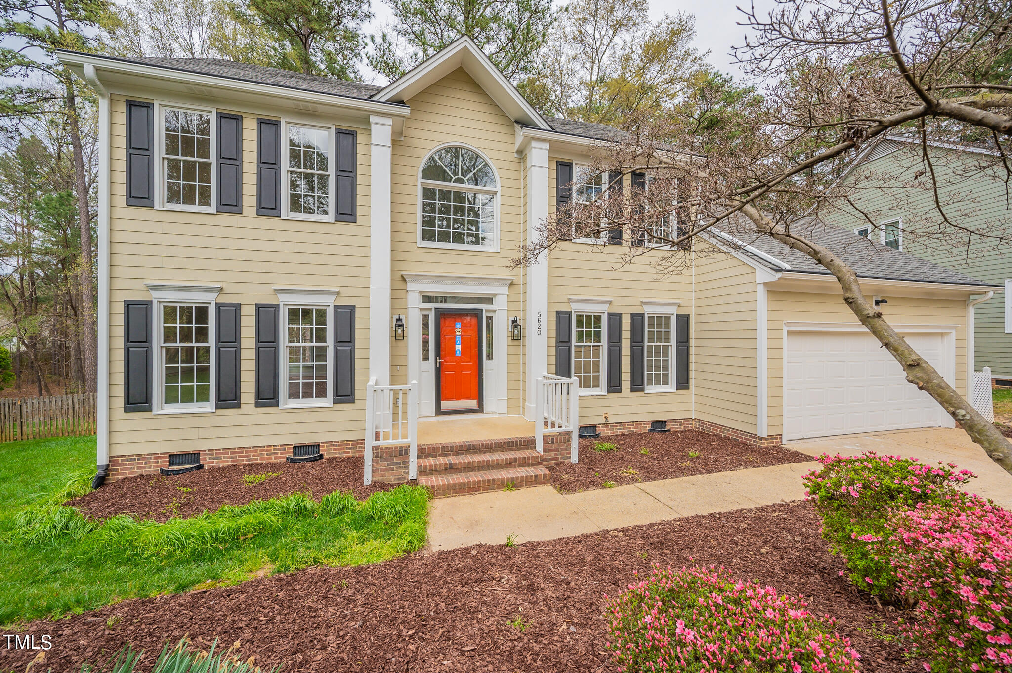 5620 Raddington Street Raleigh, NC 27613 - Photo 1 of 41 a front view of a house with garden