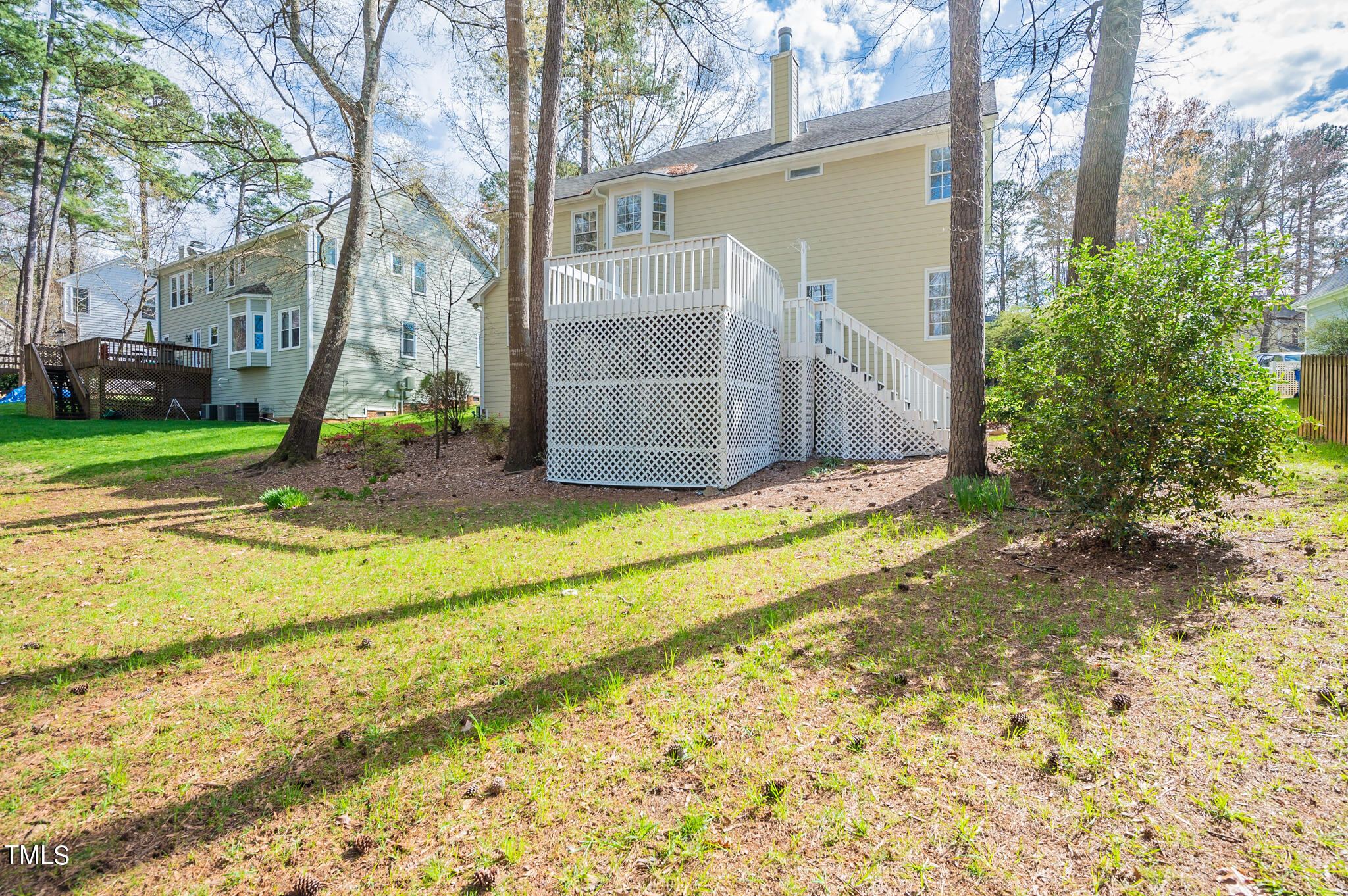 5620 Raddington Street Raleigh, NC 27613 - Photo 39 of 41 a view of a house with backyard and trees