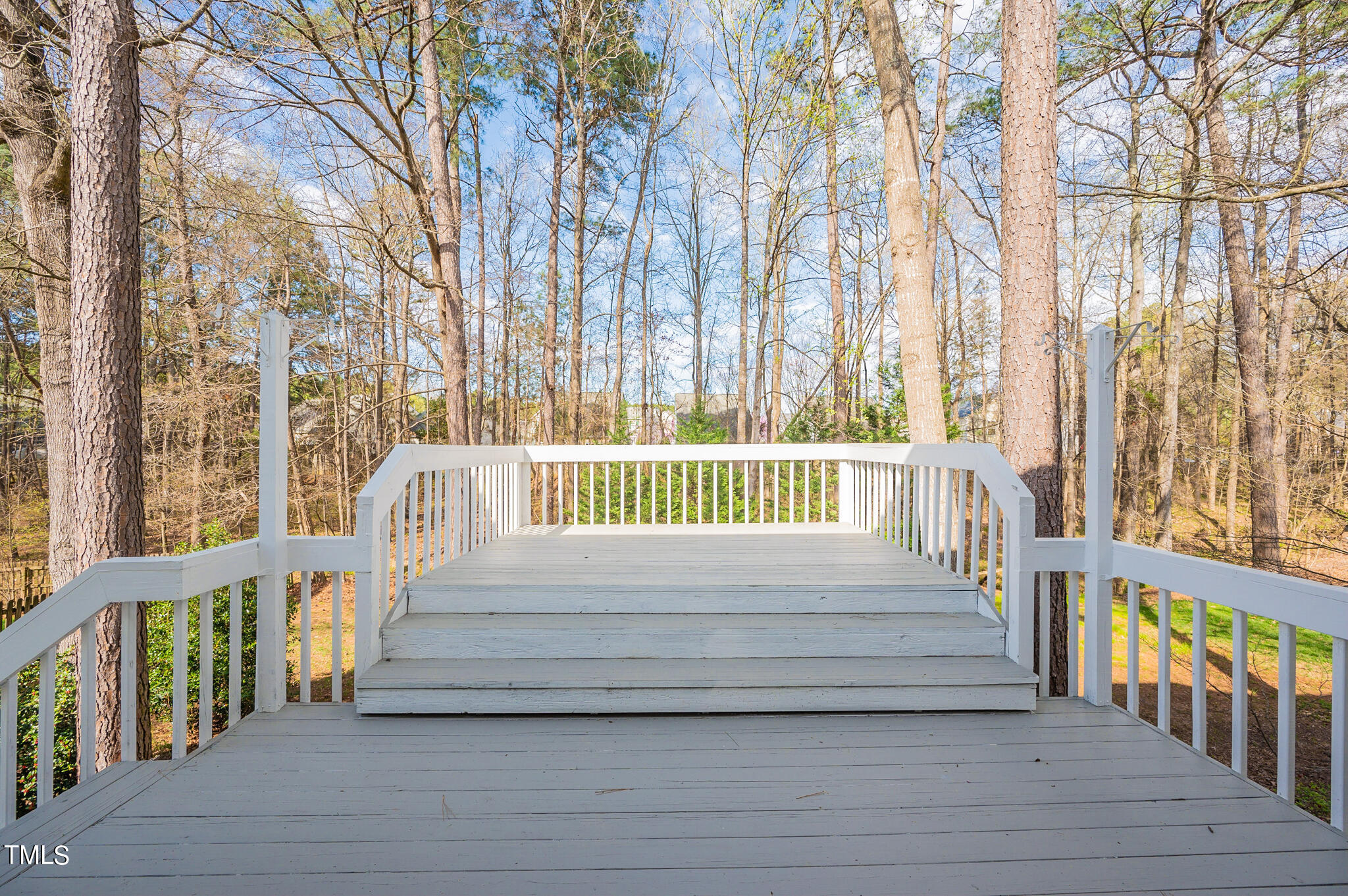 5620 Raddington Street Raleigh, NC 27613 - Photo 41 of 41 a view of a wooden deck and trees with wooden fence