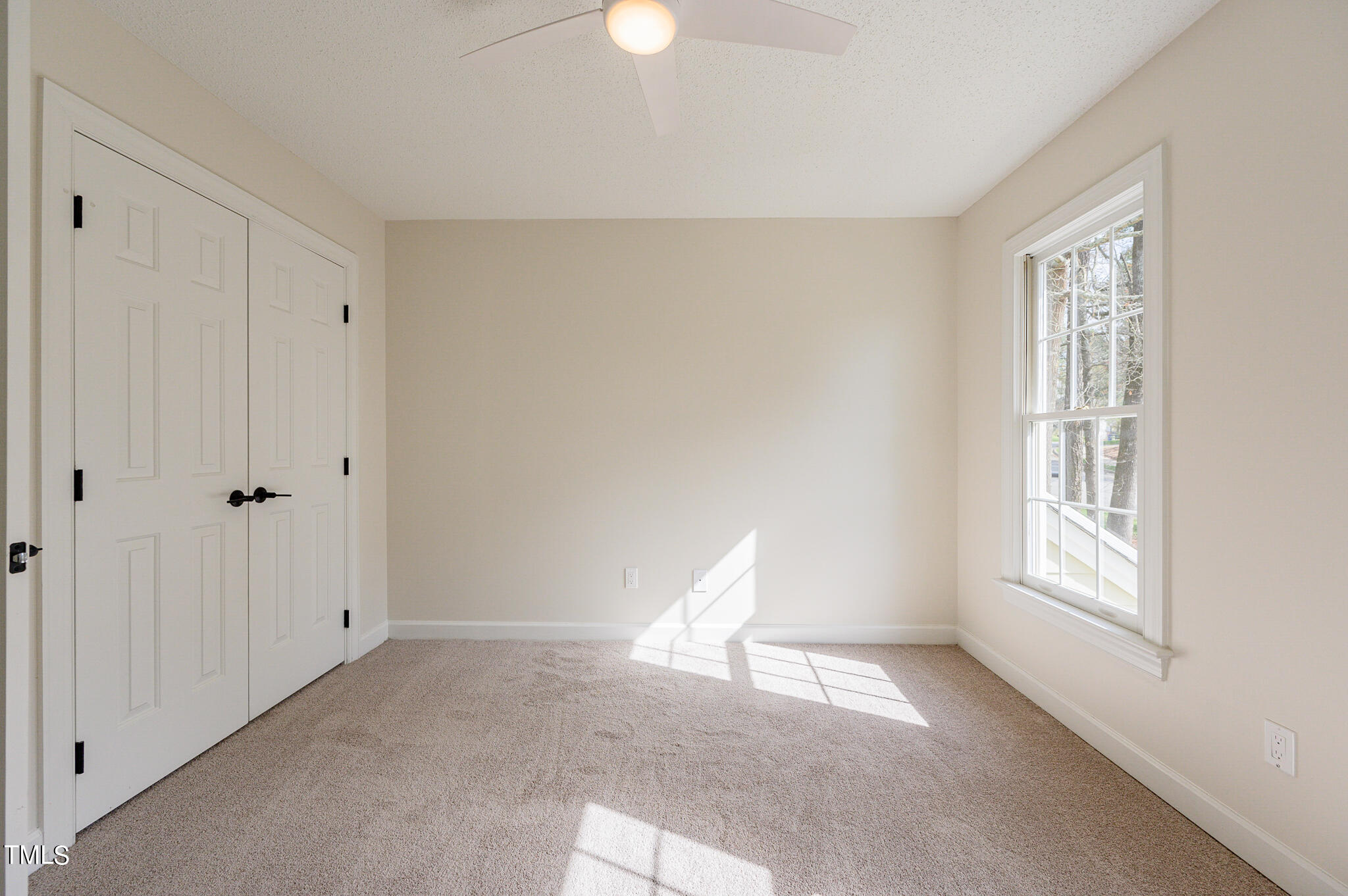 5620 Raddington Street Raleigh, NC 27613 - Photo 5 of 41 a view of an empty room with a window