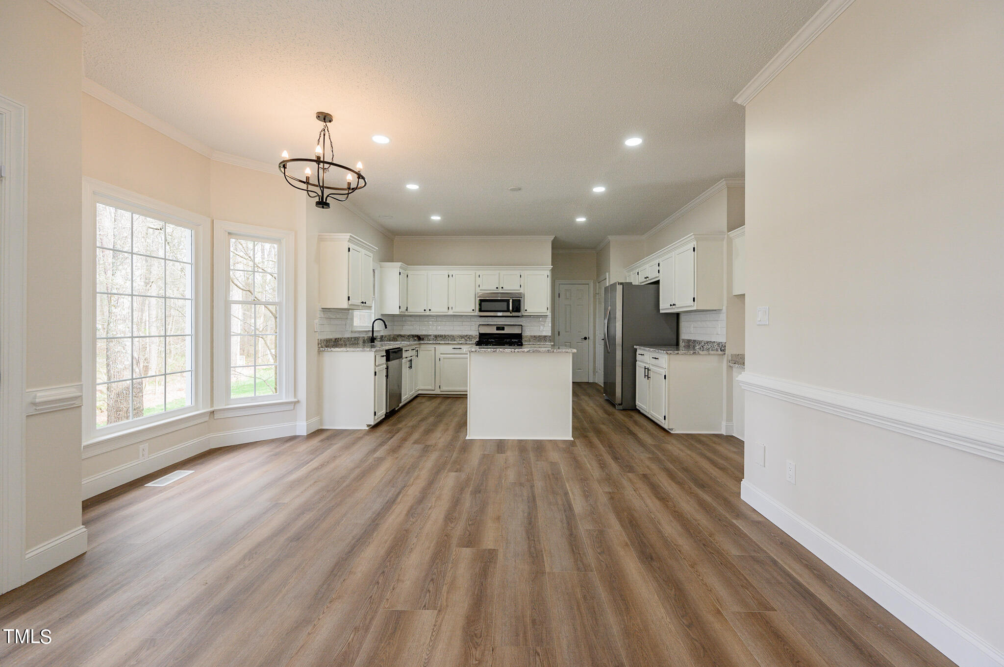 5620 Raddington Street Raleigh, NC 27613 - Photo 9 of 41 a view of kitchen with wooden floor and electronic appliances