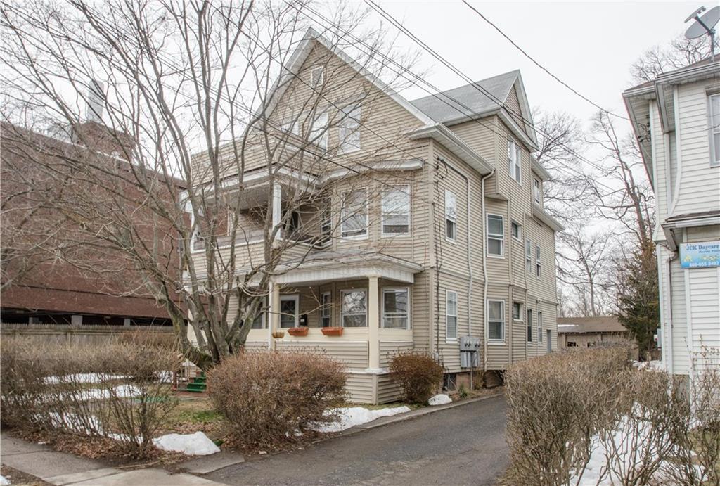 36 Merrill Street Hartford, CT 06106 - Photo 1 of 1 a front view of a building with a garden