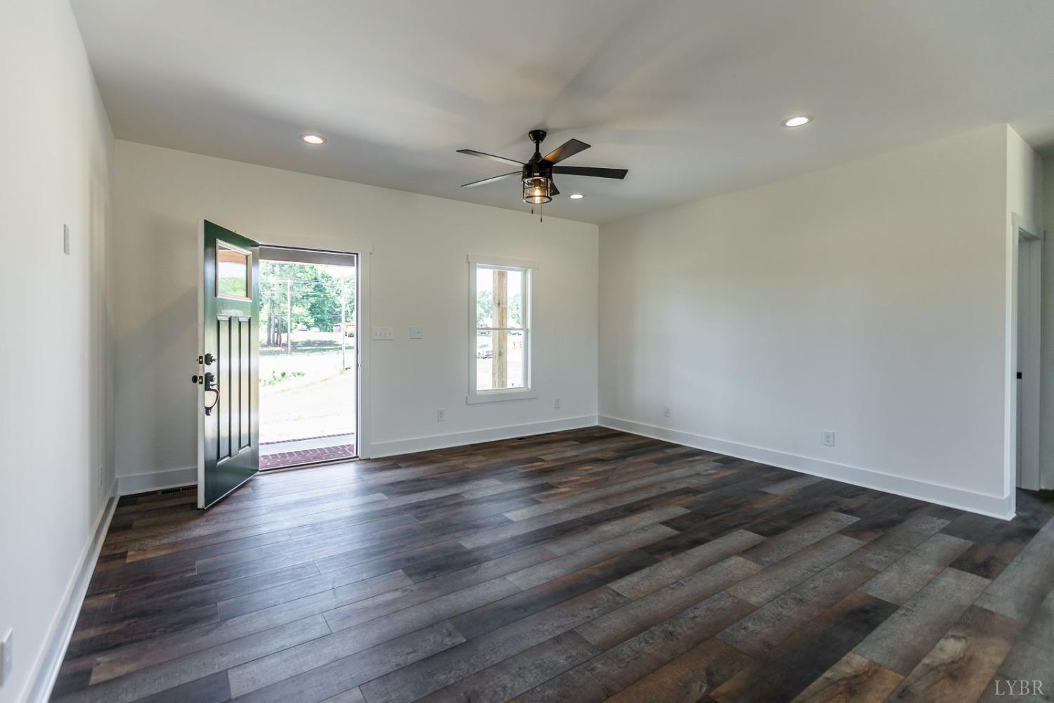 9740 Oakville Road Gladstone, VA 24553 - Photo 35 of 75 an empty room with wooden floor and windows