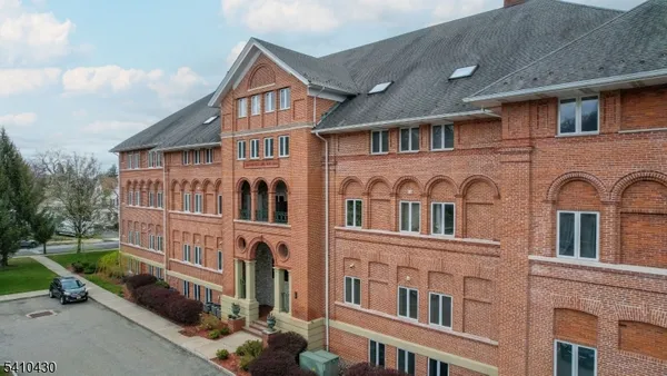 a front view of residential houses with yard