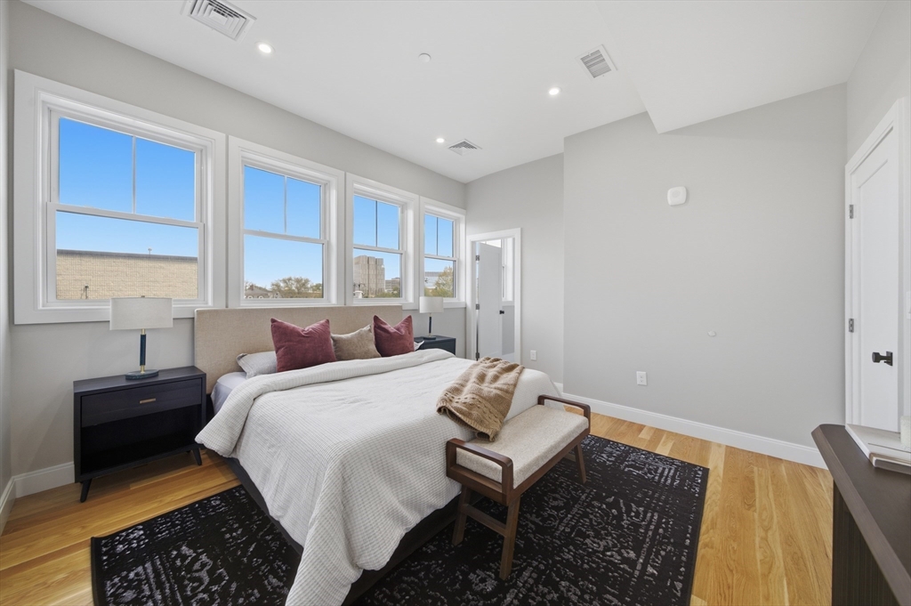 174 Walnut Street, Unit 3 Somerville, MA 02145 - Photo 31 of 38 a bed room with a bed and a window