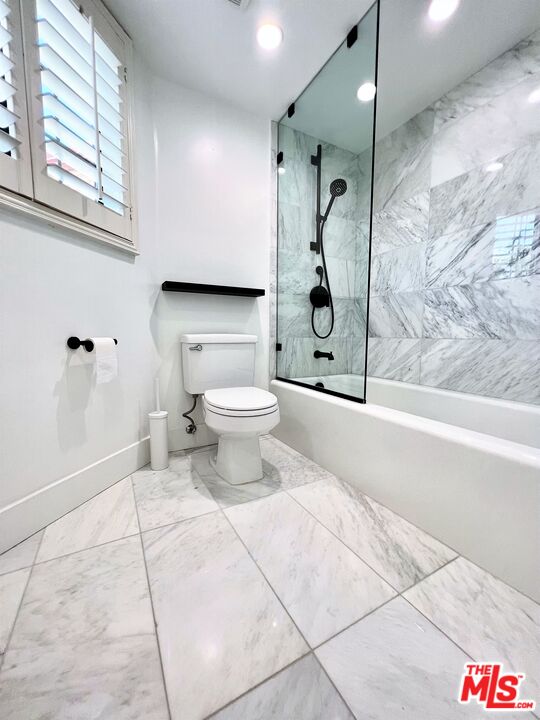 1128 17th Street, Unit E Santa Monica, CA 90403 - Photo 15 of 25 a bathroom with a toilet and a shower