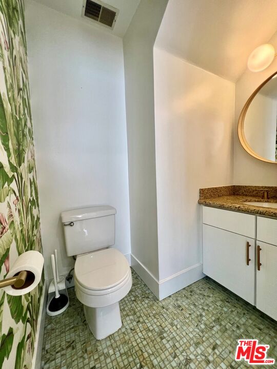 1128 17th Street, Unit E Santa Monica, CA 90403 - Photo 19 of 25 a bathroom with a toilet and a sink