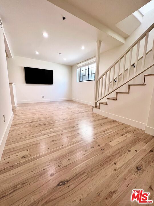 1128 17th Street, Unit E Santa Monica, CA 90403 - Photo 8 of 25 a view of entryway and hall with wooden floor