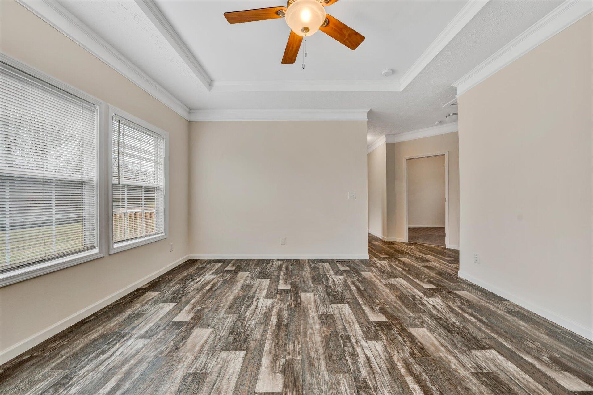 4993 Horseshoe Bend Road Goodview, VA 24095 - Photo 24 of 30 a view of an empty room with wooden floor and a window