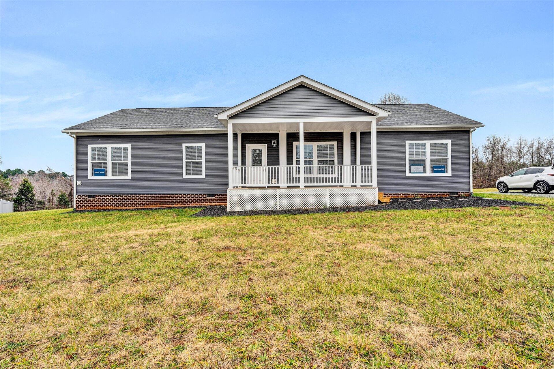 4993 Horseshoe Bend Road Goodview, VA 24095 - Photo 3 of 30 a front view of a house with swimming pool