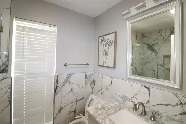 a bathroom with a bathtub and a sink