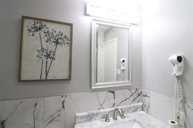 a bathroom with a bathtub and shower