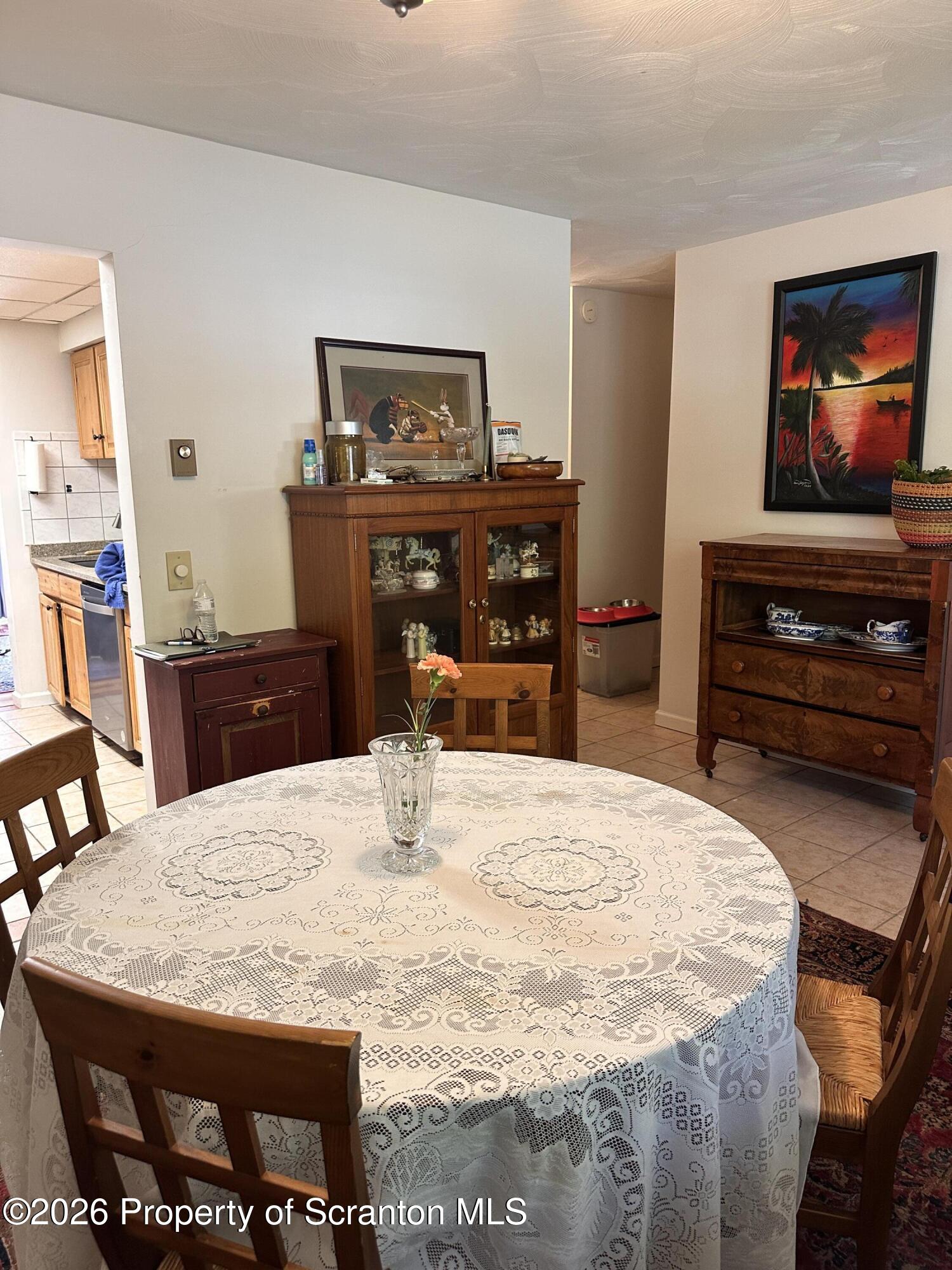 107 Keystone Hls Road, Unit 405 Factoryville, PA 18419 - Photo 8 of 27 a dining room with a table and chairs