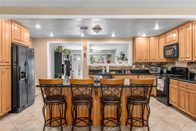 a dining table with chairs and window