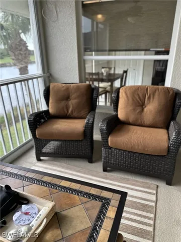 a living room with furniture and a rug