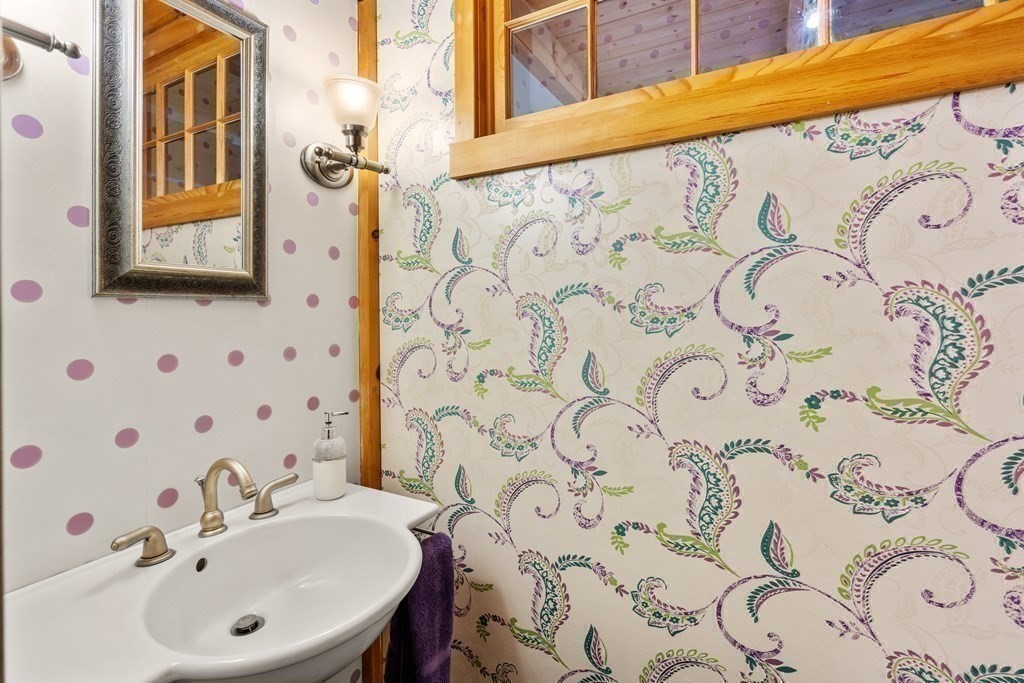 66 Fiskdale Road Brookfield, MA 01506 - Photo 13 of 32 a bathroom with a sink and mirror with toilet