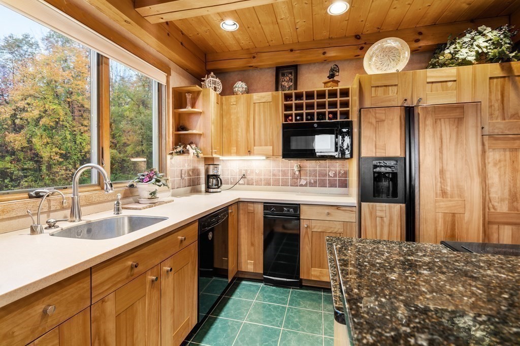 66 Fiskdale Road Brookfield, MA 01506 - Photo 16 of 32 a kitchen with a sink stove and refrigerator