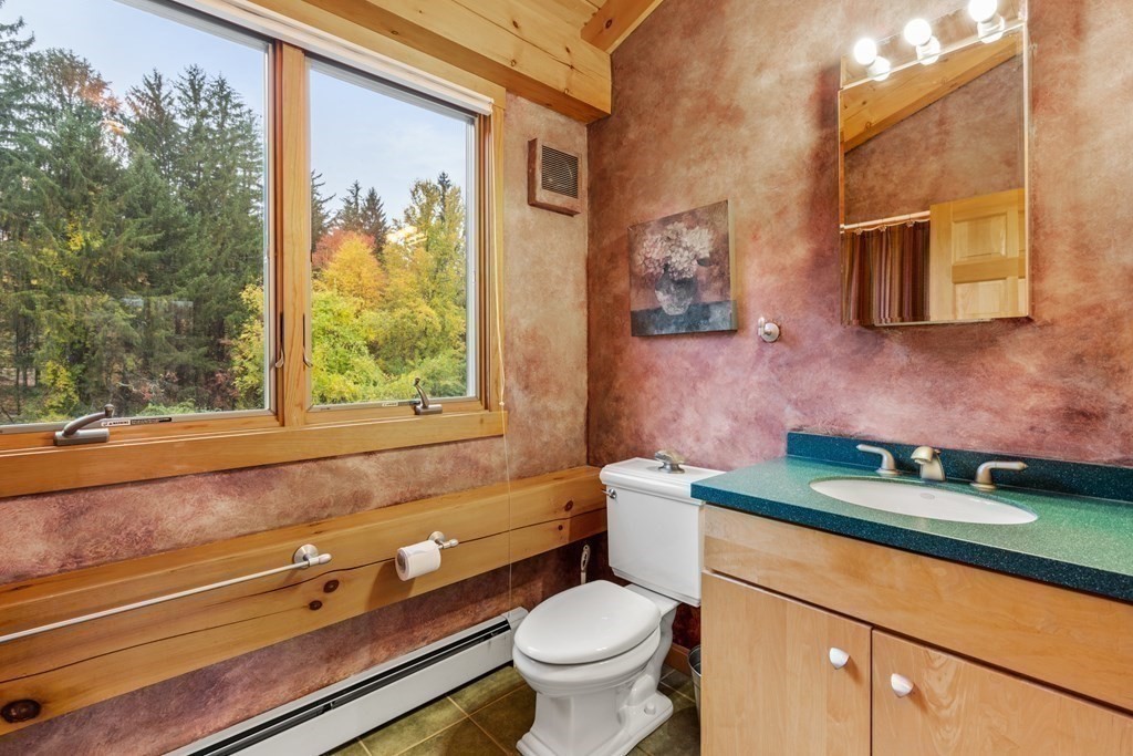 66 Fiskdale Road Brookfield, MA 01506 - Photo 20 of 32 a bathroom with a toilet a sink and a window