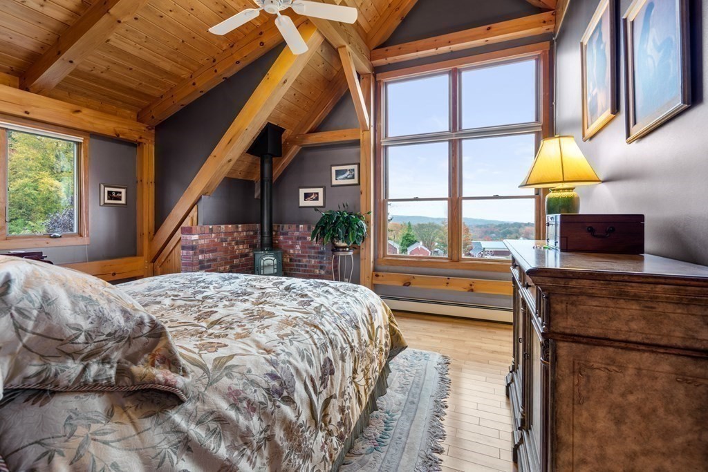 66 Fiskdale Road Brookfield, MA 01506 - Photo 23 of 32 a bedroom with a bed and a large window