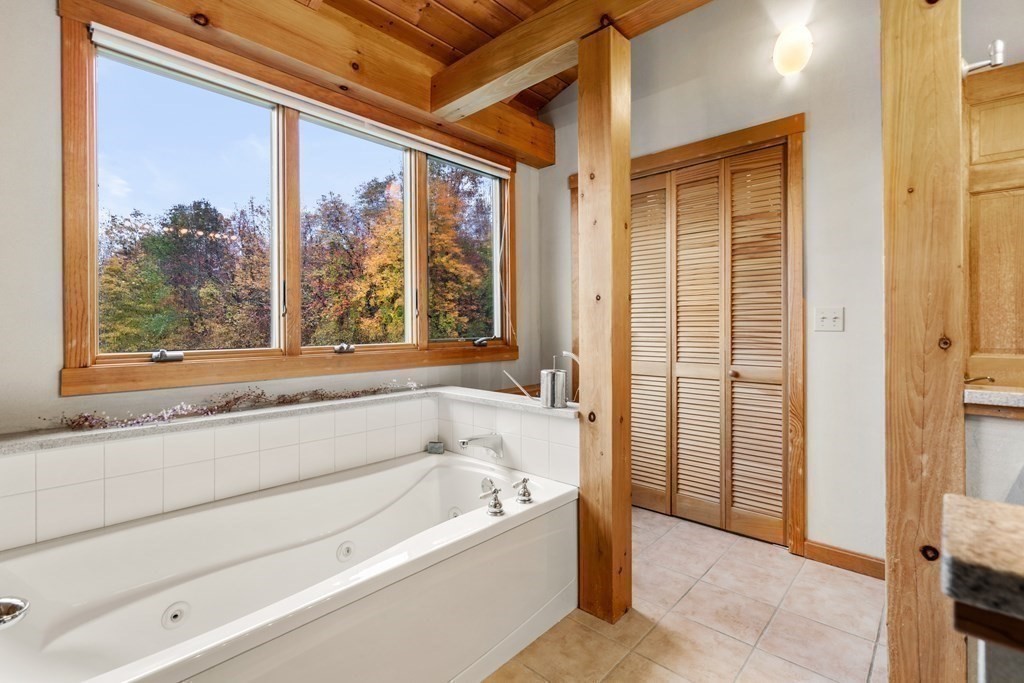 66 Fiskdale Road Brookfield, MA 01506 - Photo 28 of 32 a bathroom with a bathtub and a shower