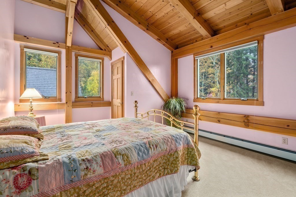66 Fiskdale Road Brookfield, MA 01506 - Photo 29 of 32 a spacious bedroom with a large bed and a large window