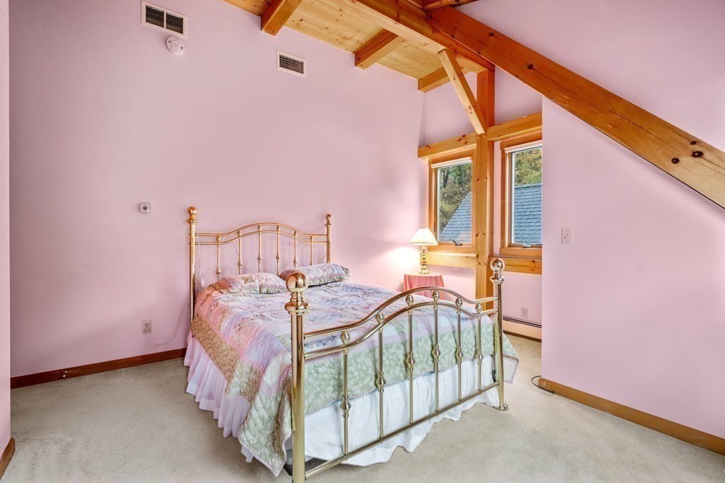 66 Fiskdale Road Brookfield, MA 01506 - Photo 30 of 32 a spacious bedroom with a bed and a table