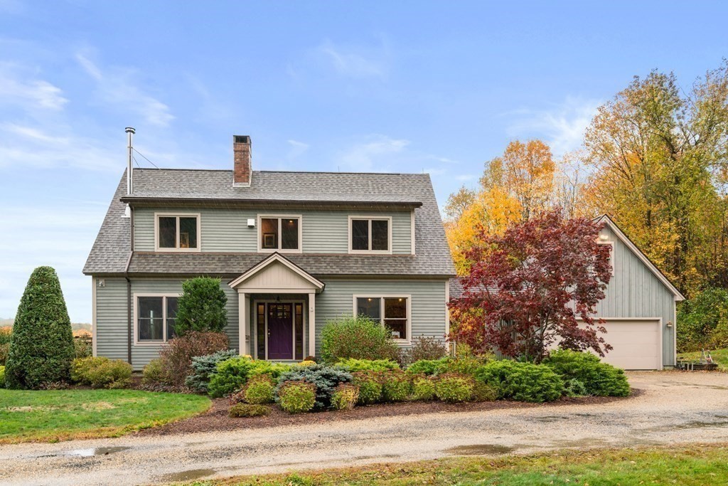 66 Fiskdale Road Brookfield, MA 01506 - Photo 4 of 32 a front view of a house with garden