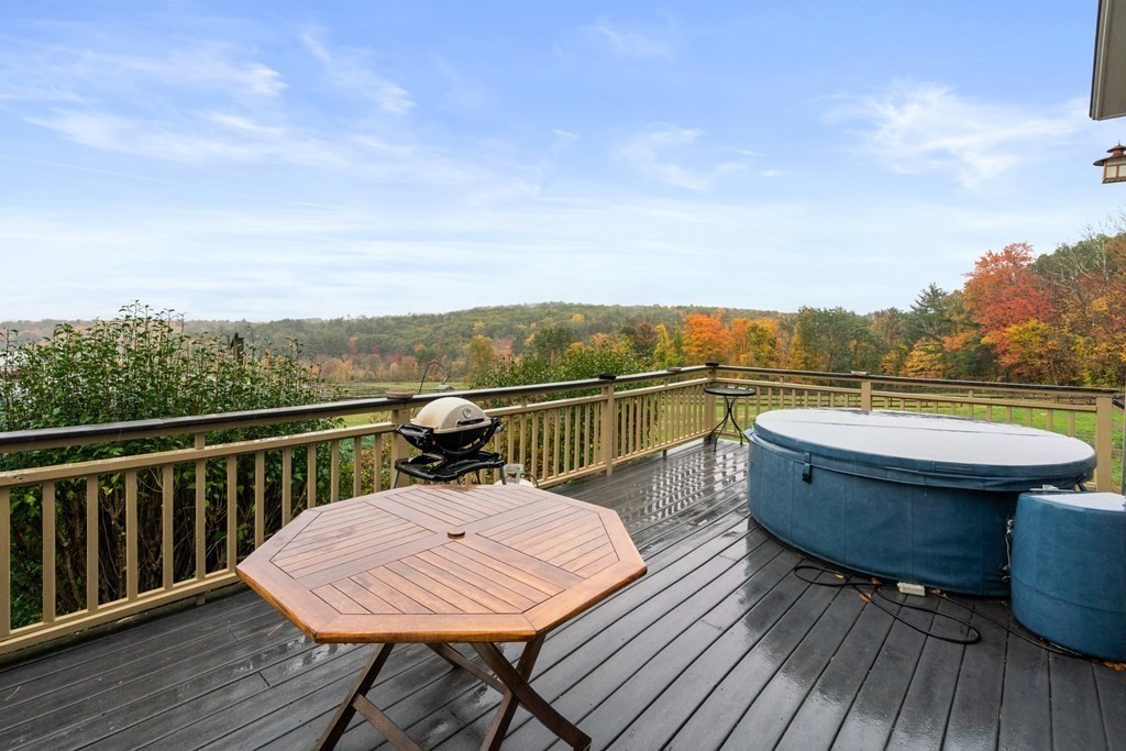 66 Fiskdale Road Brookfield, MA 01506 - Photo 5 of 32 a view of a roof deck with wooden floor and seating