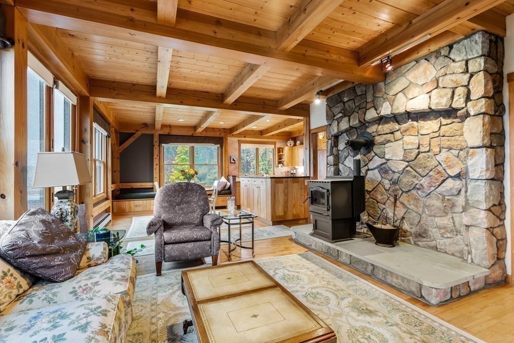 66 Fiskdale Road Brookfield, MA 01506 - Photo 10 of 32 a living room with furniture and a fireplace