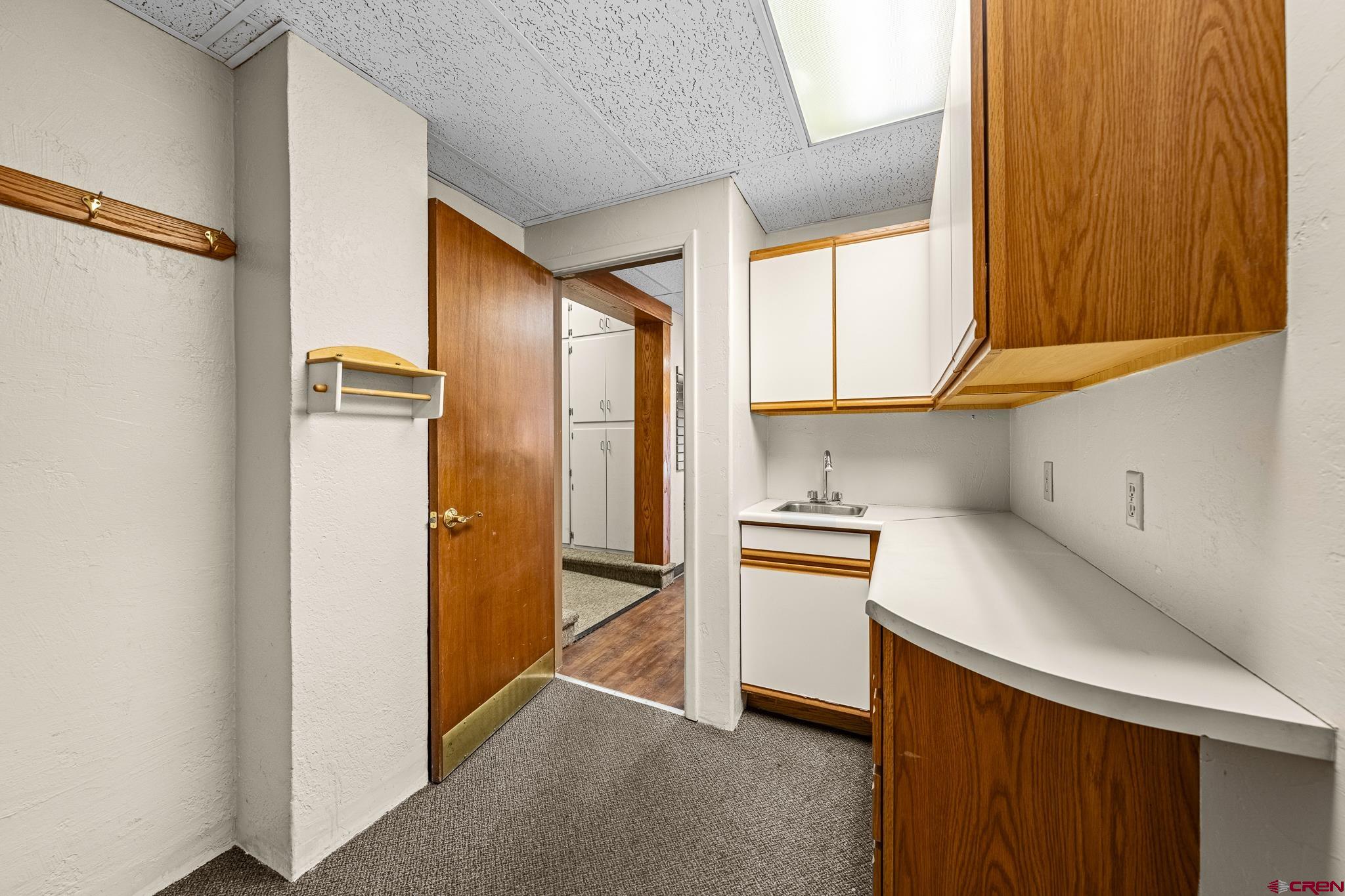 1304 Main Avenue Durango, CO 81301 - Photo 15 of 35 a kitchen with stainless steel appliances a refrigerator sink and cabinets