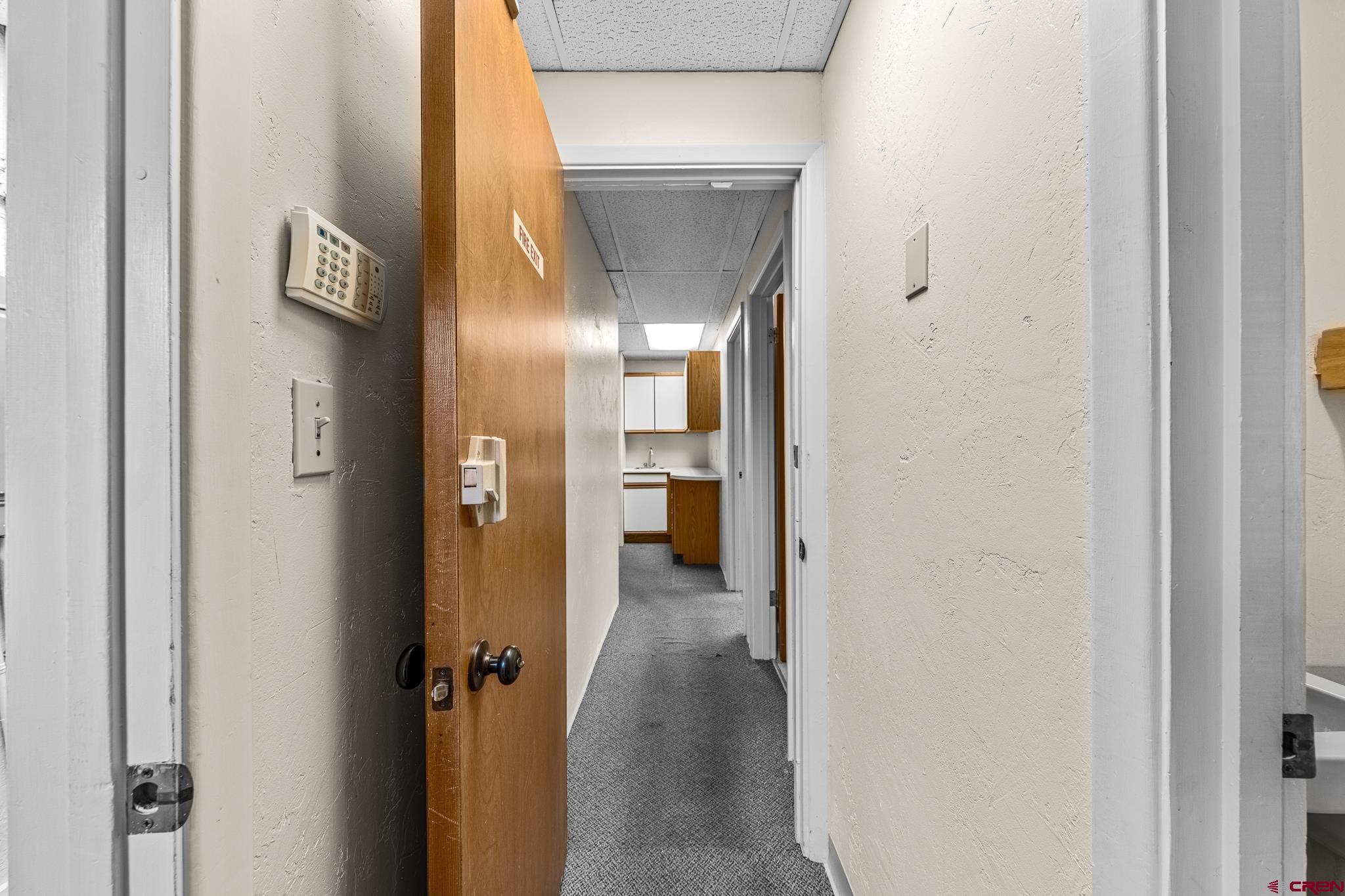 1304 Main Avenue Durango, CO 81301 - Photo 18 of 35 a view of a hallway with wooden shelves
