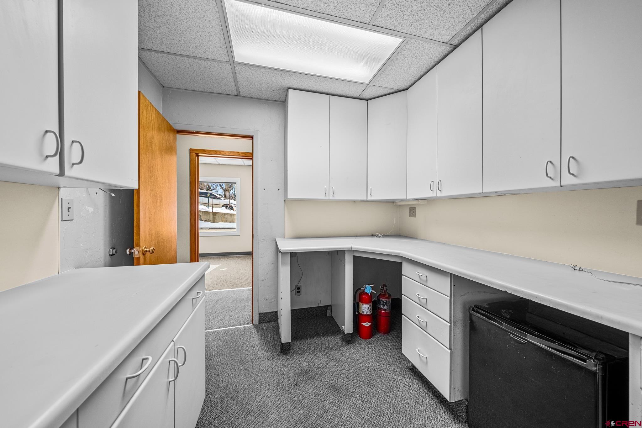 1304 Main Avenue Durango, CO 81301 - Photo 26 of 35 a kitchen with a sink and cabinets