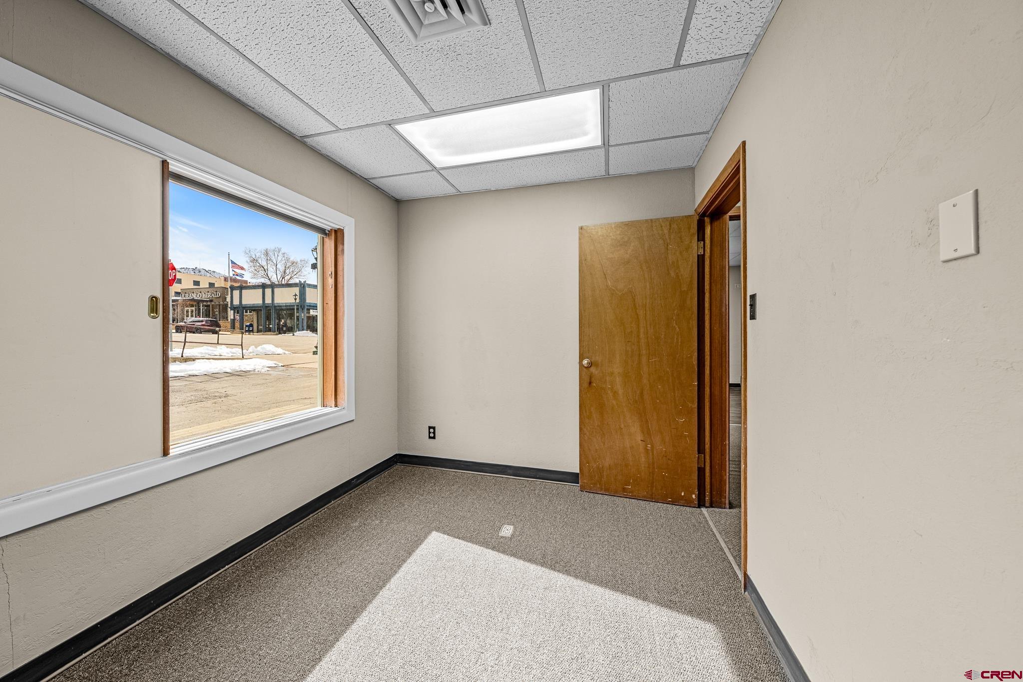1304 Main Avenue Durango, CO 81301 - Photo 28 of 35 a view of an empty room with a window