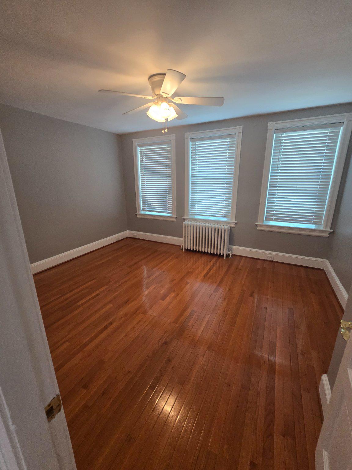 540 14th Street Southeast Washington, DC 20003 - Photo 3 of 11 a view of an empty room with wooden floor and a window