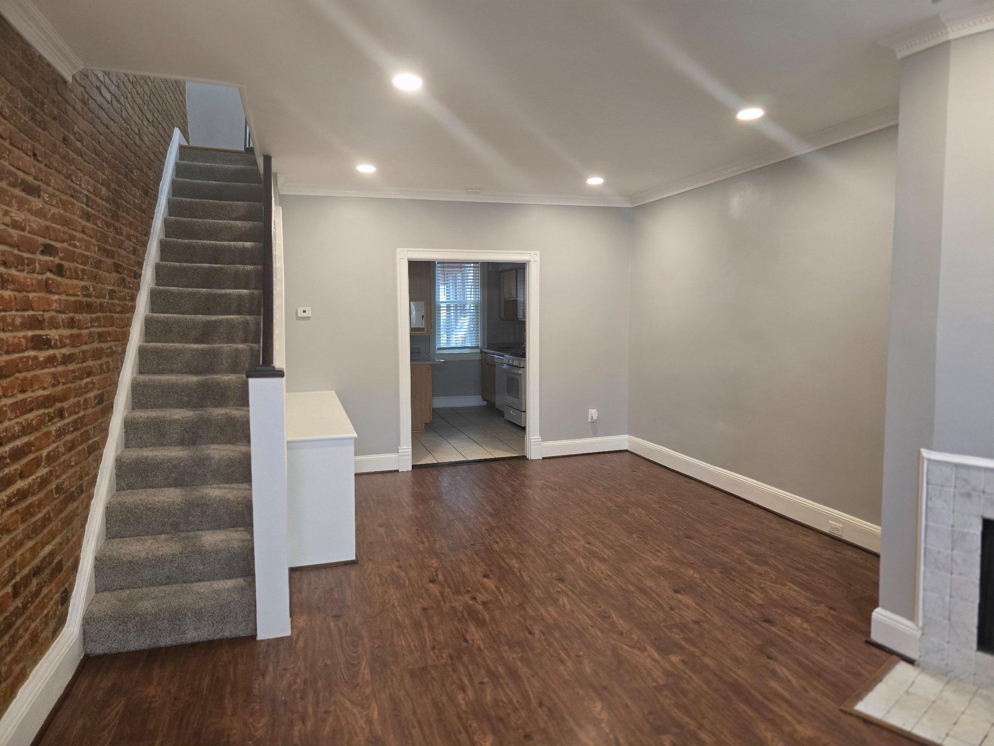 540 14th Street Southeast Washington, DC 20003 - Photo 4 of 11 wooden floor in an empty room with a staircase