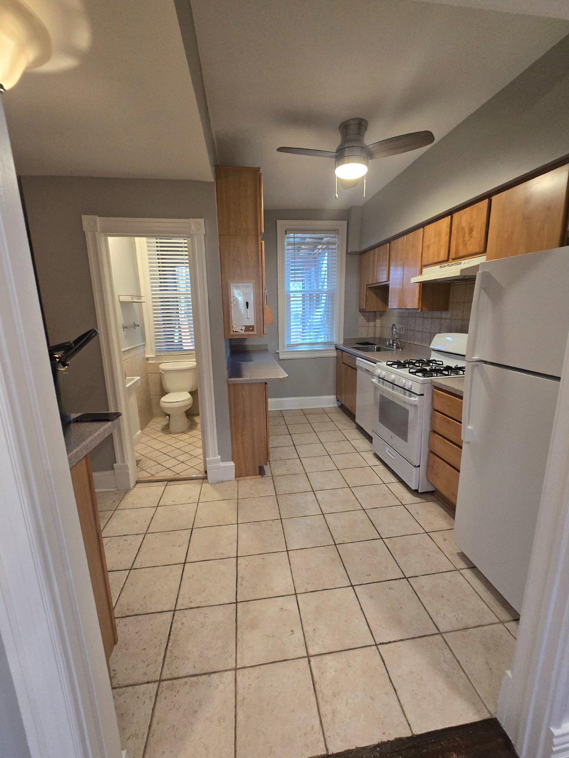 540 14th Street Southeast Washington, DC 20003 - Photo 7 of 11 a large white kitchen with a stove a refrigerator a sink and dishwasher