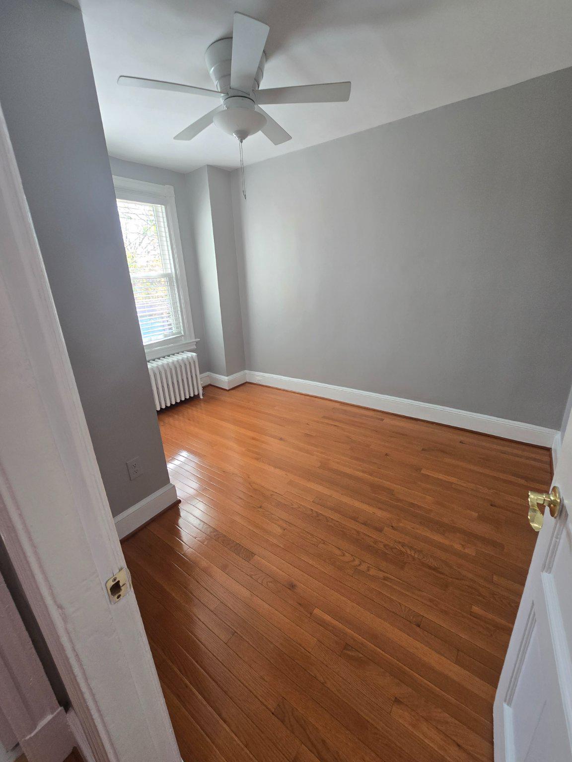 540 14th Street Southeast Washington, DC 20003 - Photo 8 of 11 wooden floor in an empty room with a window