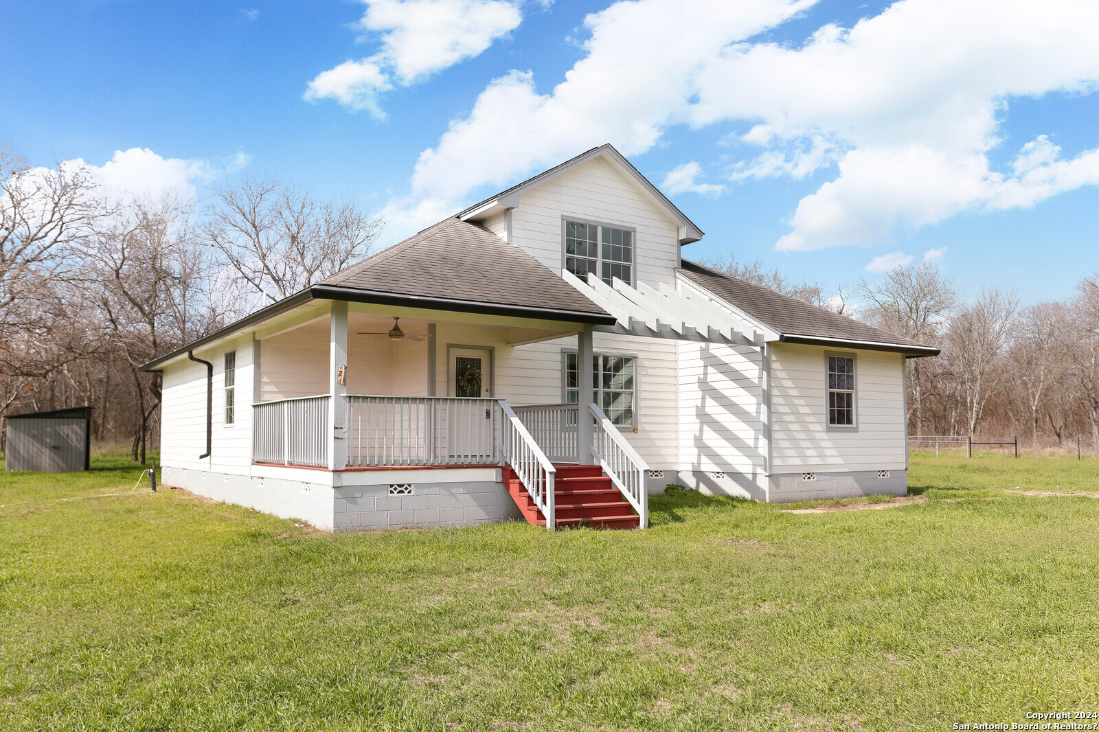19349 Fm 463 Devine, TX 78016 - Photo 1 of 1 a front view of house with yard and entertaining space