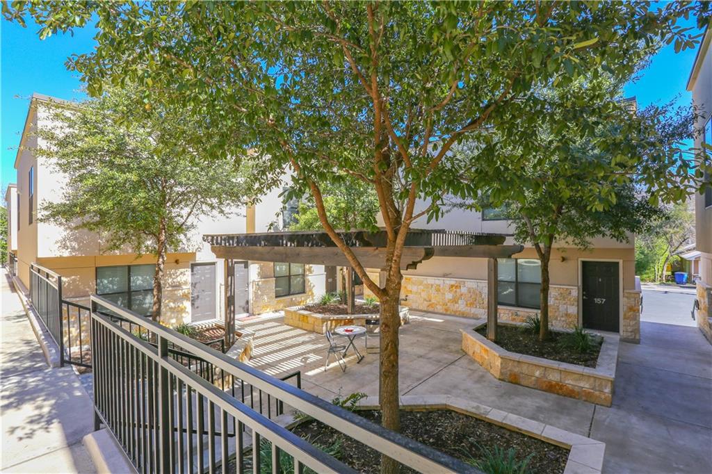 711 West 32nd Street, Unit 115 Austin, TX 78705 - Photo 21 of 23 a view of a house with backyard