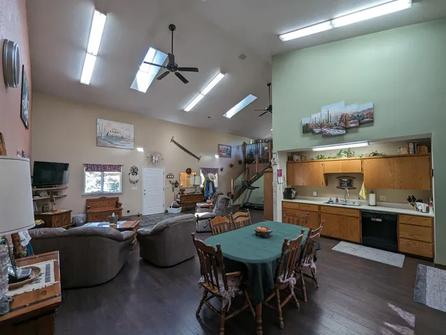 a room with a refrigerator and a dresser