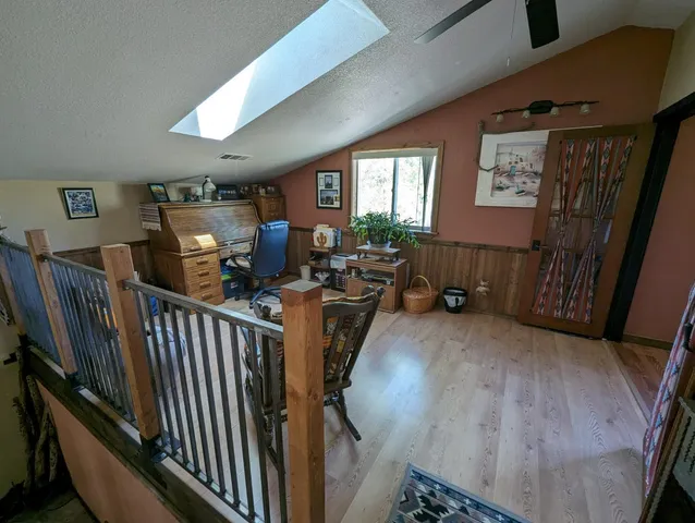 a bedroom with furniture window and a wooden floor